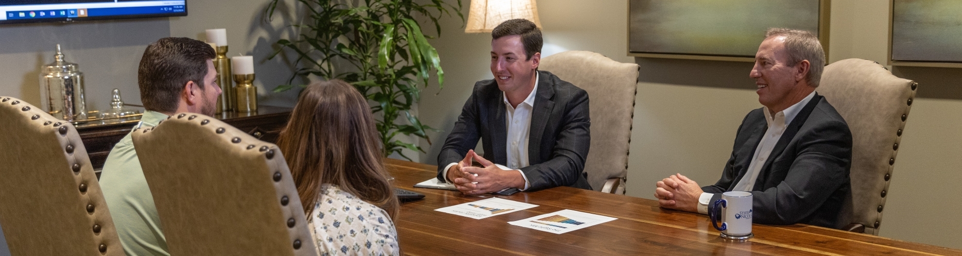 Skinner Wealth Management Group meeting with clients in the office conference room